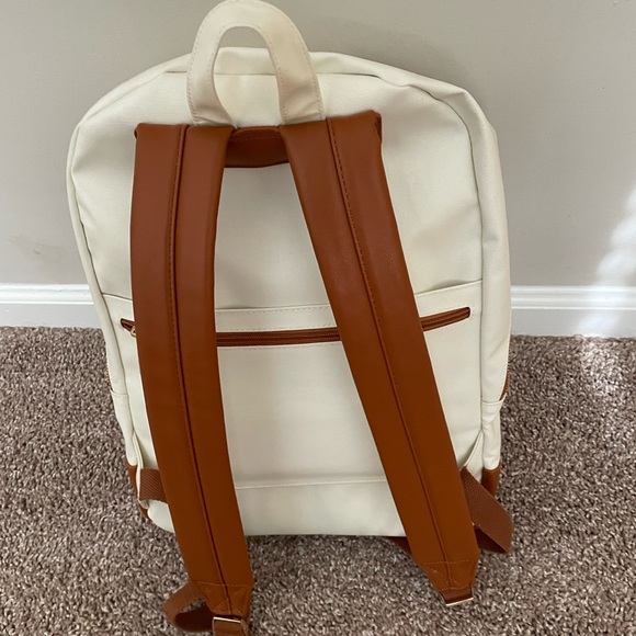 Cream diaper bag from honest company. Never used